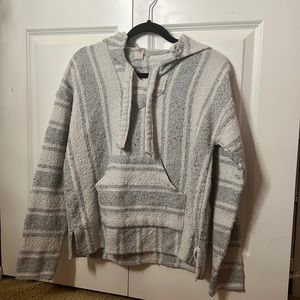 white and grey poncho